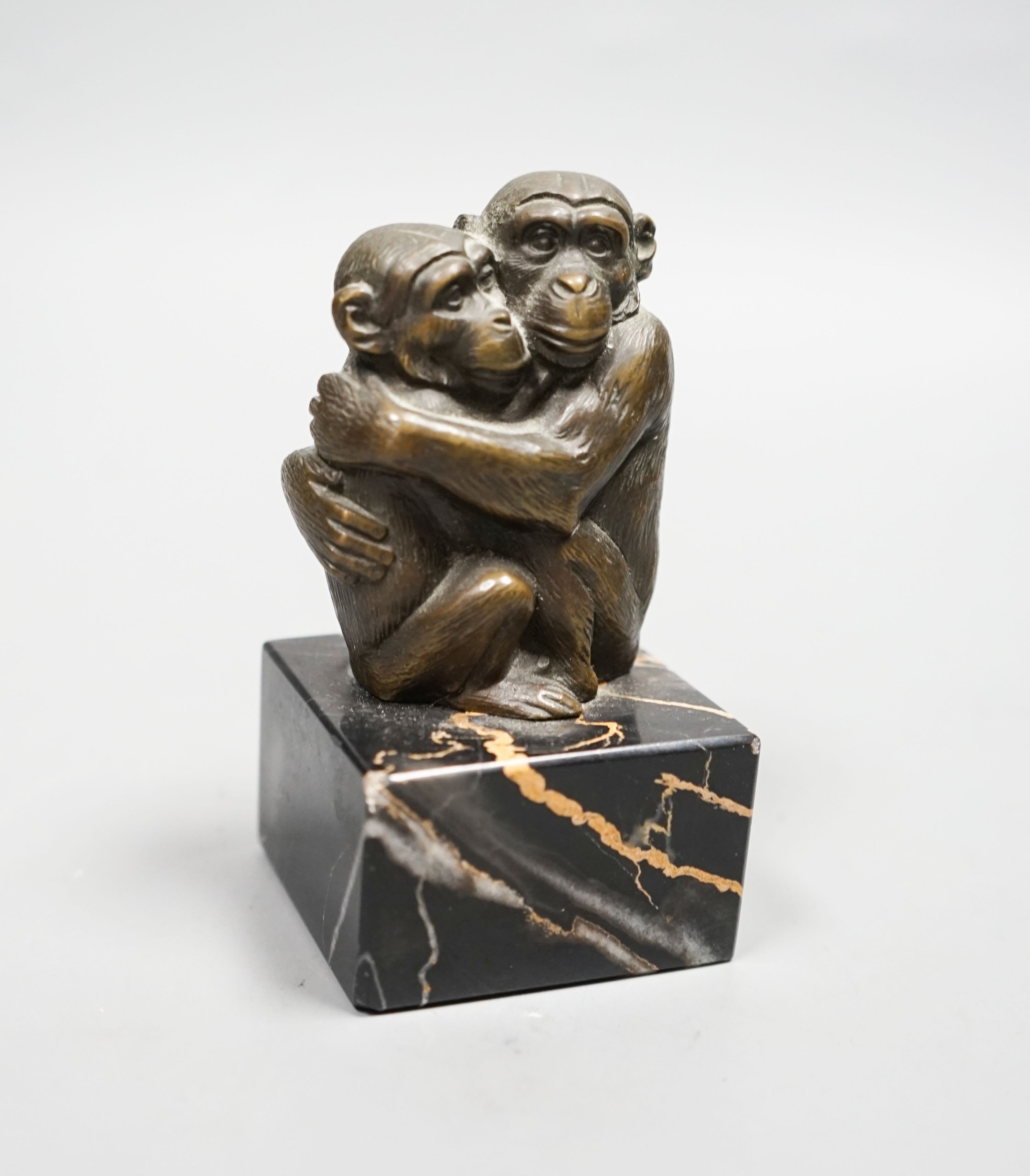 After Barye, bronze, Two monkeys embracing, on square veined black marble plinth, 10cm H 10cm